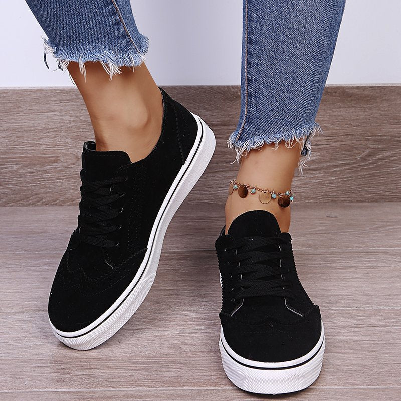 Elegantes zapatillas planas con cordones